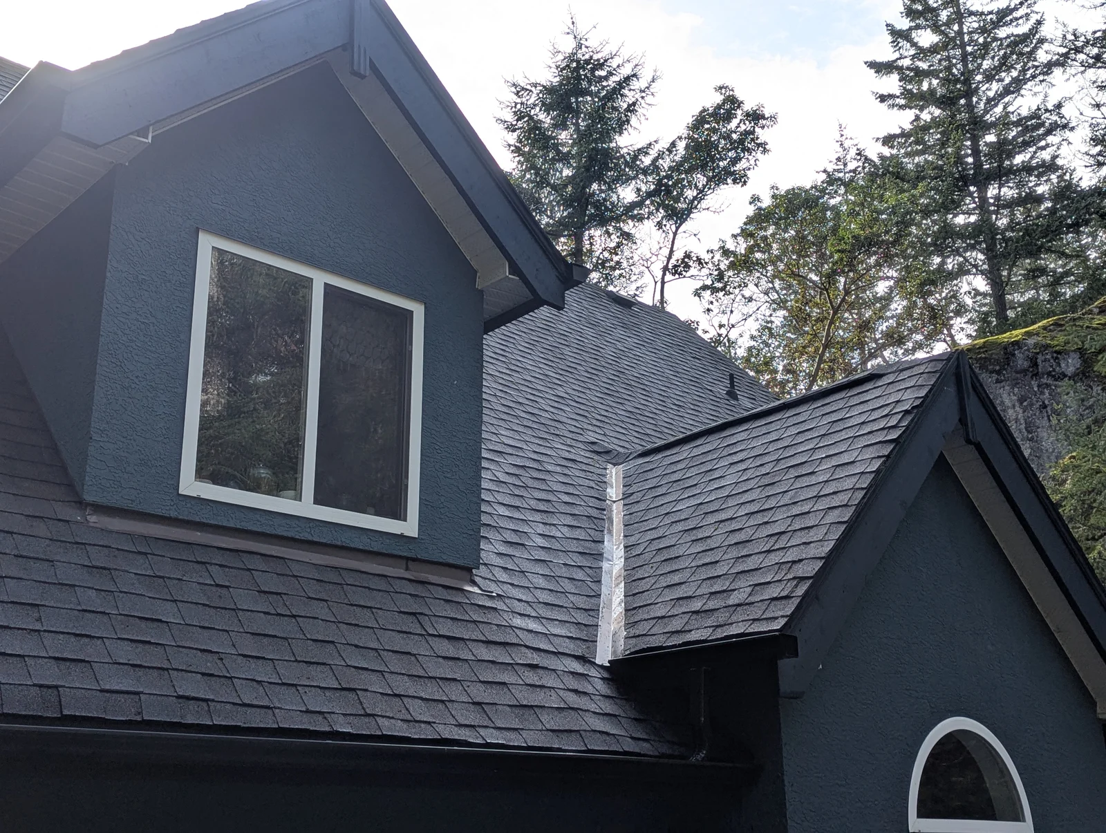 A cleaner roof around the dormer — after cleaning